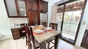 Dining for 4 plus a desk area and caged back porch