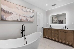 Soak your stress away in the large private soaking tub in the Master bathroom. We provide shampoo, conditioner, body soaps and bath towels for your convenience!