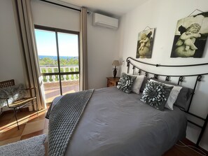 Master bedroom with direct access to huge balcony stunning sea and valley views.