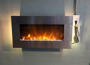 Cozy up to the fireplace with your choice of colored backlight.