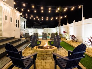 Relax and unwind with the ambience of the fire and string lights