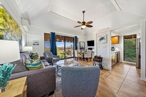 Vaulted ceilings, modern coastal décor, and a partial ocean view from the private lanai. Perfect spa