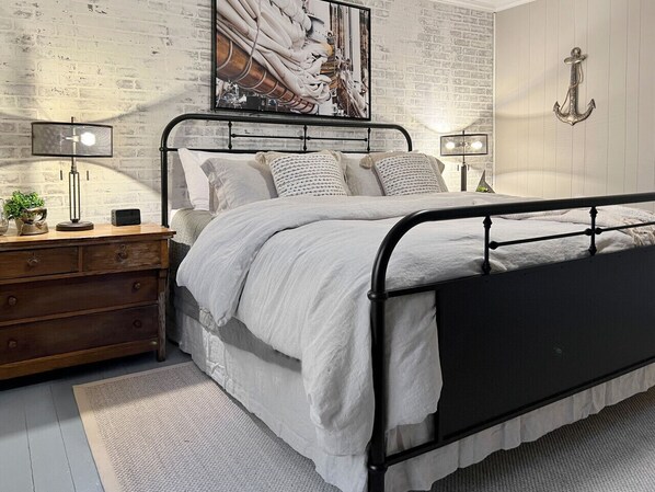 One of the two King beds- plush and luxurious bedding, TV in each room, sound machine, and a desk for working remotely!