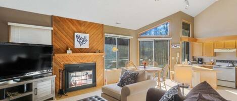 Seating, smart tv, fireplace, and access to outside area