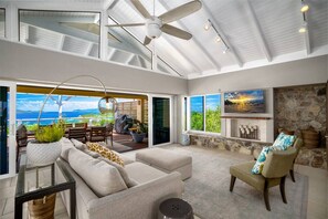 Large and luxurious living room with AC and flat screen TV