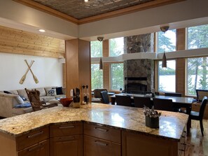 View of Great room and Shoal Lake from the kitchen at Pier 6. 