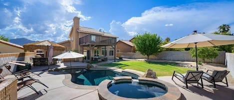 Large backyard with pool, spa, firepit, BBQ, couch and chairs and putting green!