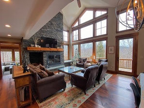 Main living room with wood burning fireplace