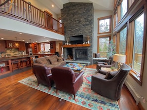 Main living room with wood burning fireplace