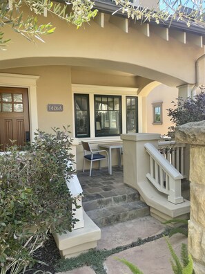 Front porch with table and chairs, rolling bar cart