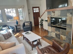 Living room with pull-out sofa bed (Queen) and gas burning fireplace