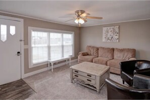 Living Room with couch and two leather chairs