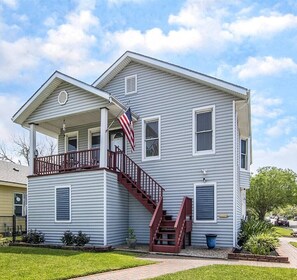 Check out the front of this amazing home! Stairs to front porch and main entrance.