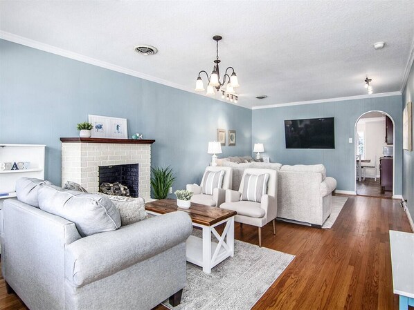 Relax in the spacious living room with 65" smart TV -comfortably seats 10