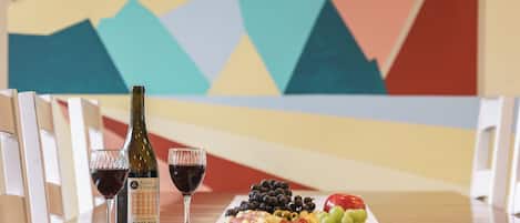 Enjoy delicious local food and wine by the mural inspired by Seaside's Tillamook head