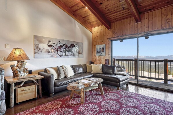 Great room. Leather sectional can sleep 1 with our provided bedding