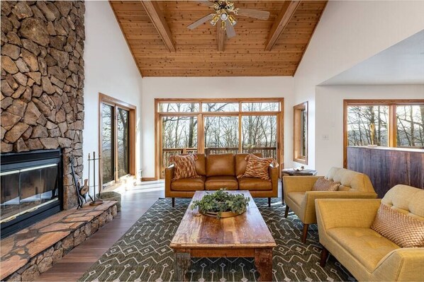 The spacious living room with mountain views all around.