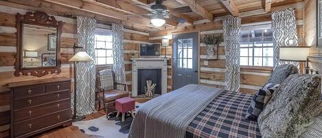 Main level bedroom with King size bed. Door opens onto screened porch.