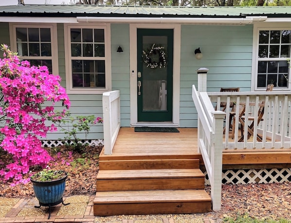 Front entrance to cottage with seating to enjoy a morning coffee or evening chat
