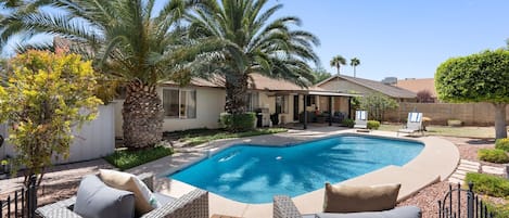 Sparkling pool and large backyard with plenty of room to spread out and enjoy the Arizona sunshine!