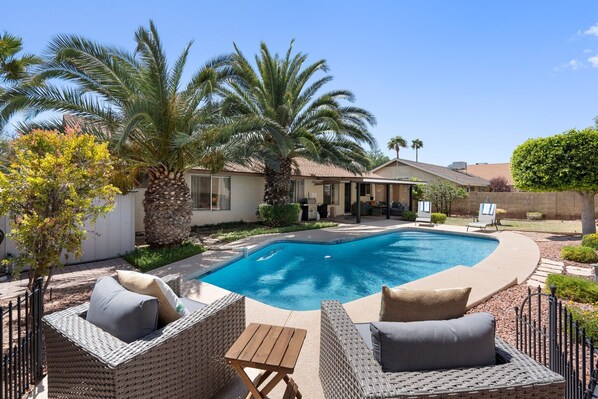 Sparkling pool and large backyard with plenty of room to spread out and enjoy the Arizona sunshine!