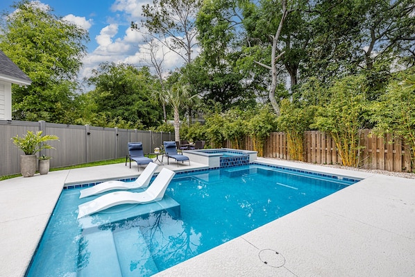 Pool and spa and backyard