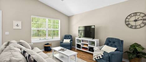 Spacious living room with cozy couch and rockling recliners