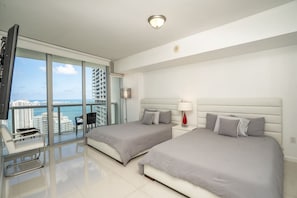 Our bedroom, 2 Wueen size beds side by side! TV.