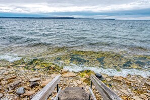 Cement stairway leads to the clear bay water