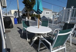 Patio with table. chairs and grill