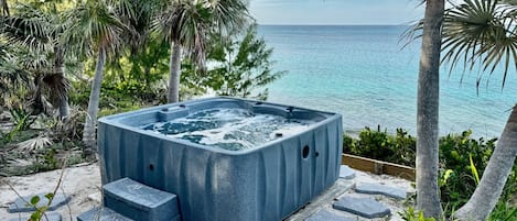 Our new ocean-view hot tub/spa, located above our beach!
