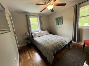Bedroom 2 with queen bed, smart TV, sound machine