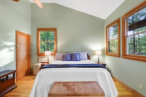 The master suite has a dreamy king bed and spacious tall ceilings. 