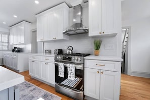 The kitchen includes all modern appliances