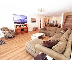 Large spacious private living area with 75 in HDTV