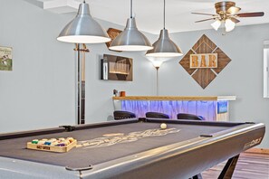 Who is breaking? Bar with LED lights underneath and wall fireplace