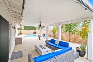 Patio with outdoor furniture and modern fire pit