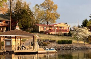 The covered back deck provides the perfect spot to gaze out at the water.