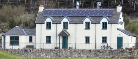 Exterior view with solar panels and lawn