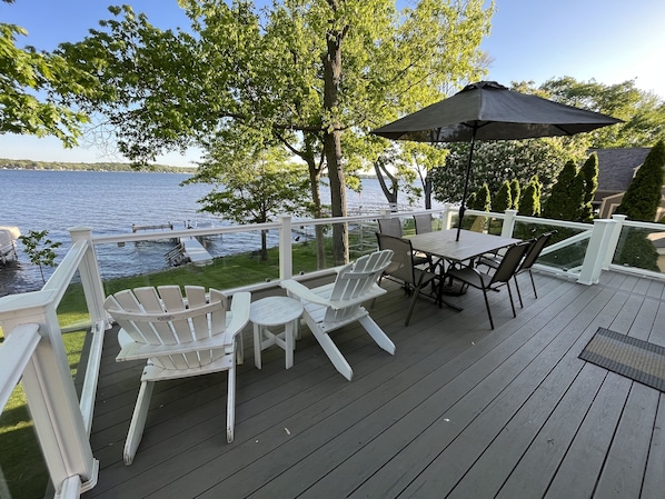 Large deck overlooking Pewaukee Lake.  Patio doors open to the living room.
