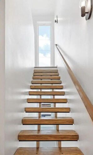 Beautiful natural lighting and unique stairs.