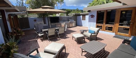 Summer kitchen w retractable shade awnings