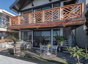 View of Bottom Patio and Top Balcony with Stairs