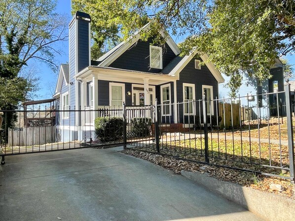 Enjoy your own private gated driveway (rare in the city) and a fenced-in yard