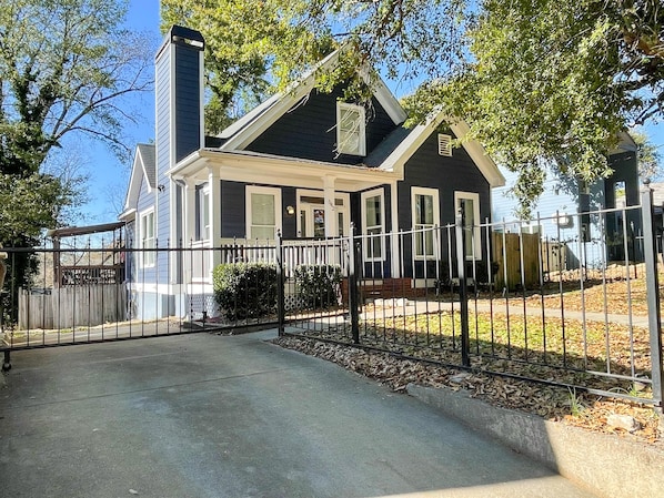 Enjoy your own private gated driveway (rare in the city) and a fenced-in yard