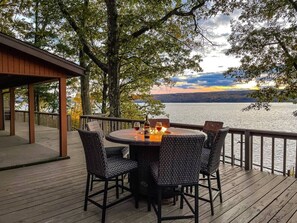 Deck | 800 sq/ft with amazing lake views | Propane fire table seats 6 | Gas Grill | Additional Seating Under Covered Area or at Railing Bar Top