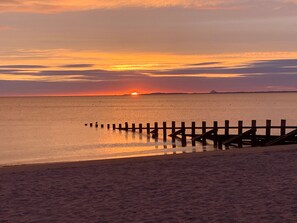 Sunrise from Portobello beach with Berwick Law in the distance