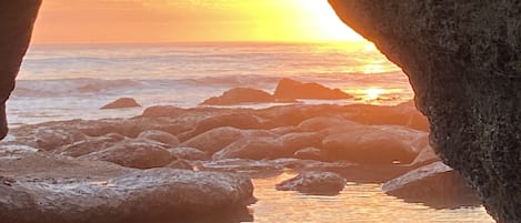 At low tide, take the stairs down to the tall rock monolith at Mitchell's Cove.