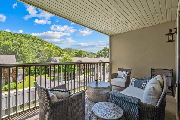 Deck looking towards Lake Taneycomo, with a partial view thru trees.