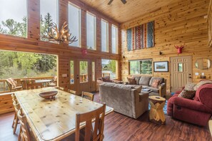 Riverside Haven's open living room and dining area overlooking the river.